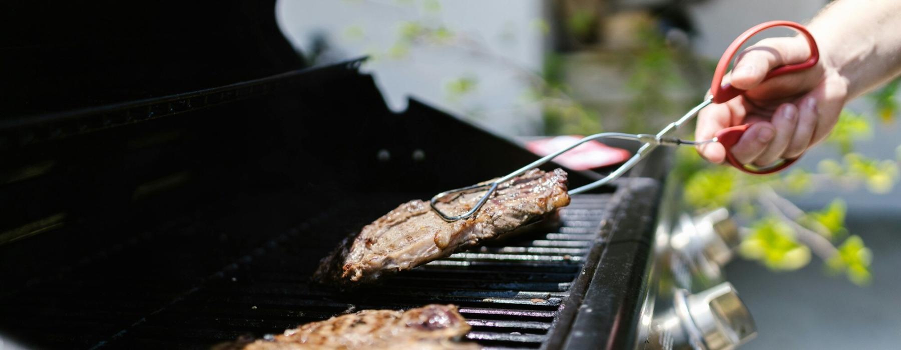 a person grilling meat